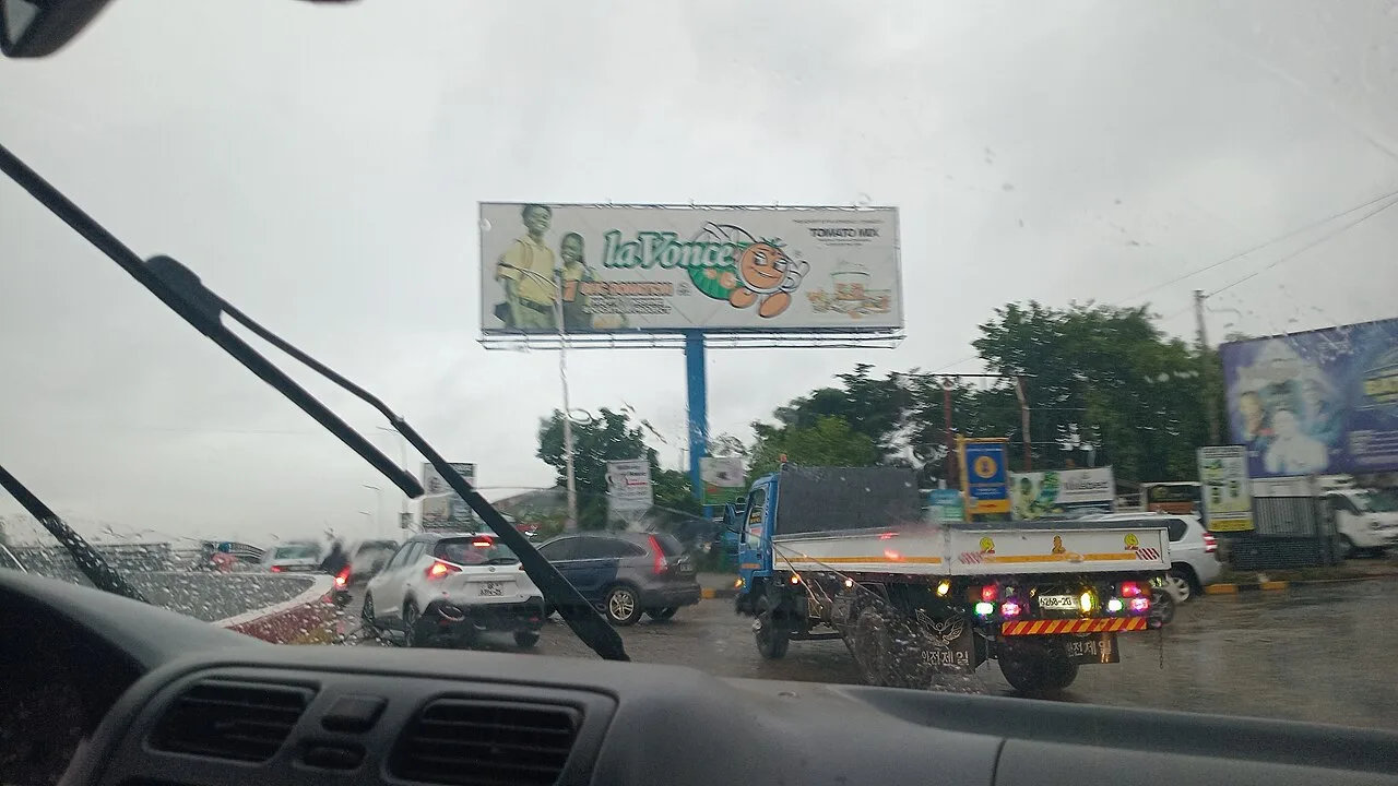 Raindrops on the windscreen of a car heading towards Kwame Nkrumah Circle in the Greater Accra Region